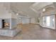 Expansive living room with a fireplace, tile flooring, and abundant natural light from large windows at 4455 W Ford Ave, Las Vegas, NV 89139