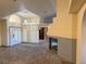 Bright and airy living room with a fireplace, tile floors, and a decorative light fixture at 4455 W Ford Ave, Las Vegas, NV 89139