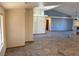 Open-concept living area with tile floors, neutral walls, and access to other rooms at 4455 W Ford Ave, Las Vegas, NV 89139
