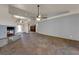 Spacious living room featuring tile flooring, a fireplace, and ample space for relaxing and entertaining at 4455 W Ford Ave, Las Vegas, NV 89139