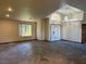 Open living room with vaulted ceiling, tile flooring, and bright natural light at 4455 W Ford Ave, Las Vegas, NV 89139