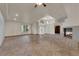 Open-concept living room with tile floors, fireplace, and natural light streaming through the windows at 4455 W Ford Ave, Las Vegas, NV 89139