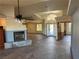 Spacious living room featuring a fireplace, tile floors, and seamless transitions to other rooms at 4455 W Ford Ave, Las Vegas, NV 89139