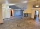 Expansive living room featuring tile floors, recessed lighting, ceiling fan, fireplace, and blue accent walls at 4455 W Ford Ave, Las Vegas, NV 89139