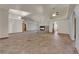 Spacious living room featuring tile flooring, high ceilings, and a cozy fireplace at 4455 W Ford Ave, Las Vegas, NV 89139