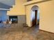 Spacious living room with fireplace, tile flooring, and cozy ambiance at 4455 W Ford Ave, Las Vegas, NV 89139