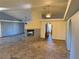 Vast living room features a fireplace, ceiling fan, recessed lights, tile floors, and arched doorways at 4455 W Ford Ave, Las Vegas, NV 89139