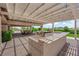 This outdoor kitchen has a built-in grill, bar area, with a large covered patio and pavers at 4455 W Ford Ave, Las Vegas, NV 89139