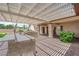 Outdoor kitchen featuring a built-in grill, granite countertops, and pergola at 4455 W Ford Ave, Las Vegas, NV 89139