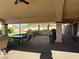 Covered patio with an outdoor kitchen, featuring a built-in grill and counter space at 4455 W Ford Ave, Las Vegas, NV 89139