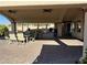 Large covered patio perfect for outdoor entertaining with seating, grill, and ceiling fans at 4455 W Ford Ave, Las Vegas, NV 89139