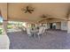 Spacious covered patio with a built-in grill, dining, and a beautiful paver floor at 4455 W Ford Ave, Las Vegas, NV 89139