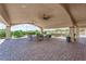Covered outdoor patio with a full kitchen, dining area, and elegant brick flooring at 4455 W Ford Ave, Las Vegas, NV 89139