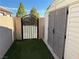View of the shed and gate in the yard on a sunny day at 4455 W Ford Ave, Las Vegas, NV 89139