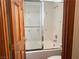 A glass-enclosed shower with white tile and decorative accents at 4455 W Ford Ave, Las Vegas, NV 89139