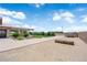 Expansive yard featuring lush lawn, desert landscaping, a spacious driveway, and a covered patio at 4455 W Ford Ave, Las Vegas, NV 89139
