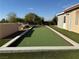 View of the bocce ball court and exterior of the home at 4455 W Ford Ave, Las Vegas, NV 89139
