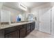 Spacious primary bathroom featuring double sinks, granite counters, and neutral color palette at 4524 Stardusk Falls Ave, North Las Vegas, NV 89084
