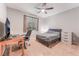 Cozy bedroom with carpet flooring, a ceiling fan, and a comfortable bed at 4524 Stardusk Falls Ave, North Las Vegas, NV 89084