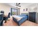 Cozy bedroom with ceiling fan, desk, and neutral colors for a relaxing atmosphere at 4524 Stardusk Falls Ave, North Las Vegas, NV 89084