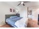 This bedroom has a ceiling fan and closet at 4524 Stardusk Falls Ave, North Las Vegas, NV 89084