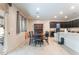 Dining space is adjacent to the kitchen, complete with a dining table and backyard views at 4524 Stardusk Falls Ave, North Las Vegas, NV 89084