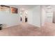 Upstairs hallway with carpet, neutral paint, and access to bedrooms and bathrooms at 4524 Stardusk Falls Ave, North Las Vegas, NV 89084