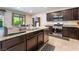 Modern kitchen with stainless steel appliances, granite countertops, and a center island at 4524 Stardusk Falls Ave, North Las Vegas, NV 89084