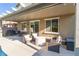 Relaxing covered patio area with comfortable seating, perfect for outdoor entertaining at 4524 Stardusk Falls Ave, North Las Vegas, NV 89084