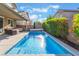 Gorgeous pool with a water feature and an inviting outdoor space for relaxing at 4524 Stardusk Falls Ave, North Las Vegas, NV 89084