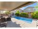 Private pool with ample patio seating and manicured landscaping for a serene outdoor retreat at 4524 Stardusk Falls Ave, North Las Vegas, NV 89084