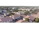 Aerial view of community with pools and palm trees, surrounded by urban cityscapes at 5000 Red Rock St # 237, Las Vegas, NV 89118