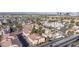 Expansive aerial view featuring the neighborhood's beautiful townhomes with city skyline in the background at 5000 Red Rock St # 237, Las Vegas, NV 89118