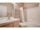 Well-lit bathroom features a shower-tub combo with storage shelving unit at 5000 Red Rock St # 237, Las Vegas, NV 89118