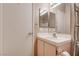 Compact bathroom with a cabinet sink, framed mirror, and bright lighting at 5000 Red Rock St # 237, Las Vegas, NV 89118