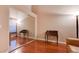 A simple bedroom with a large mirror closet, wooden floors, and a brown sofa at 5000 Red Rock St # 237, Las Vegas, NV 89118