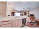 This kitchen is equipped with modern appliances and provides a view into the living room at 5000 Red Rock St # 237, Las Vegas, NV 89118