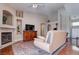 Open living room with fireplace, media center, and sliding closet door at 5000 Red Rock St # 237, Las Vegas, NV 89118