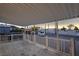 Relaxing covered back porch area with mountain views, white painted railings, and backyard access at 54 E Texas Ave, Henderson, NV 89015