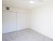 Bright bedroom featuring a large closet and neutral carpet against clean, white walls at 54 E Texas Ave, Henderson, NV 89015