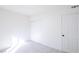 Neutral bedroom featuring a spacious closet with sliding doors, a bright interior, and carpet flooring at 54 E Texas Ave, Henderson, NV 89015