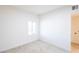 Bright bedroom with neutral carpet, a window with blinds, and white trim for a clean, modern look at 54 E Texas Ave, Henderson, NV 89015