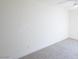 Spacious bedroom showcasing neutral carpet and a ceiling fan against clean, white walls at 54 E Texas Ave, Henderson, NV 89015