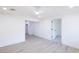 Bright bedroom with wood floors, a ceiling fan, and a glimpse into a connected room at 54 E Texas Ave, Henderson, NV 89015