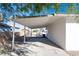 Spacious carport providing ample parking space and protection for vehicles, with access to backyard at 54 E Texas Ave, Henderson, NV 89015