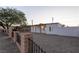 Inviting single-story home with modern appeal, gravel landscaping, and a fenced yard for added privacy at 54 E Texas Ave, Henderson, NV 89015