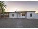Newly renovated single-story home boasting a spacious driveway and well-kept gravel landscaping at 54 E Texas Ave, Henderson, NV 89015