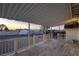 Wide-angle view of a covered patio with white railings, offering a peaceful outdoor space and neighborhood views at 54 E Texas Ave, Henderson, NV 89015