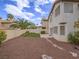 Private backyard with patio, desert landscaping, privacy wall, and partial view of upper exterior at 5452 Big Sky Ln, Las Vegas, NV 89149