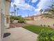 Inviting backyard features a patio, small grass area, desert landscaping, and perimeter privacy wall at 5452 Big Sky Ln, Las Vegas, NV 89149